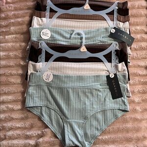 DANSKIN 9 pair panties. NWT. Very soft. Neutral colors. Medium.